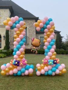 a balloon columns in front of a house